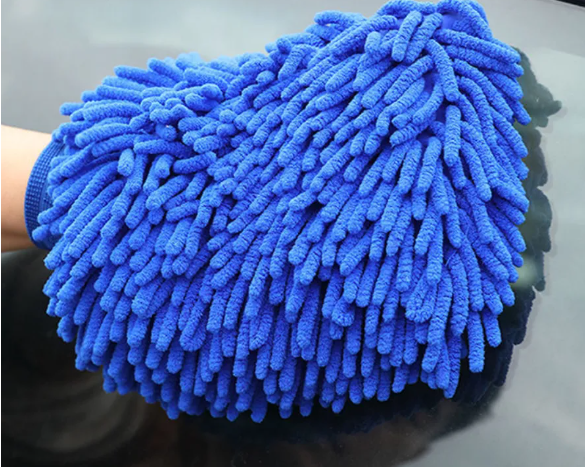 Professional microfiber auto detailing scratch-free car wash sponge pad with soapy foam on vehicle